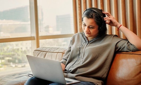 woman working on laptop in cafe