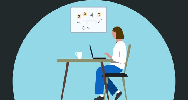 Hero image of professional in front of a desktop computer.
