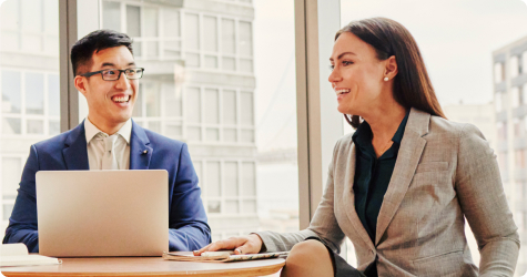 photo of two professionals talking at work