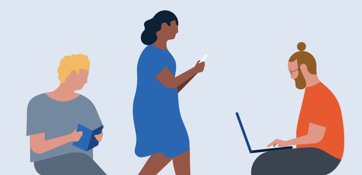 Three people working on different devices