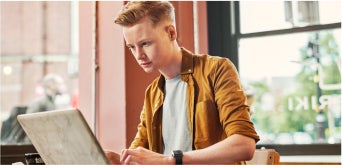 photo of a person studying on a laptop