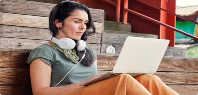 Image of professional working on a laptop