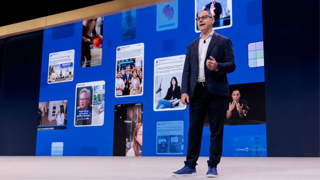 Business speaker presenting social media visuals onstage