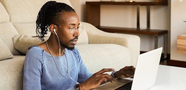 man looking at laptop