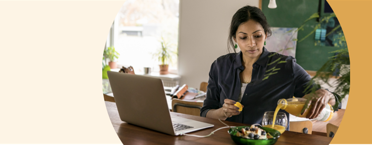 Woman and man staring at laptop screen