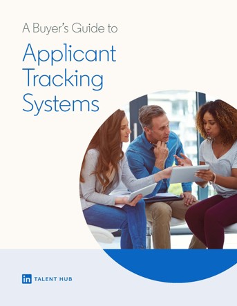 Front cover of A Buyer’s Guide to Applicant Tracking Systems. A female-presenting caucasian person and a male-presenting caucasian person look at a female-presenting African-American person explaining something on a tablet.