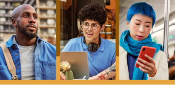 A recruiter taking notes and smiling while interviewing a potential candidate.
