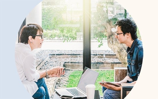 Image of two professionals talking