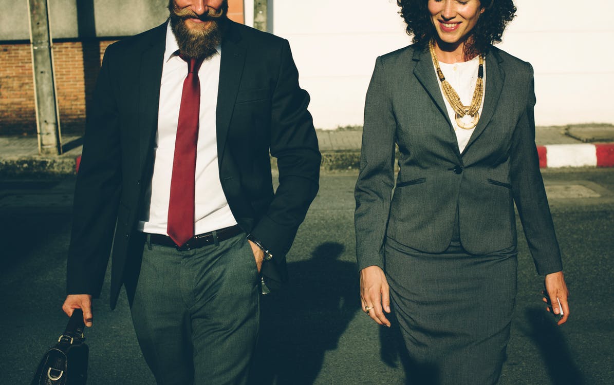 two sales people celebrate closing a deal