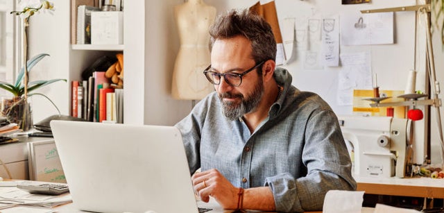 Image of professional working on a laptop