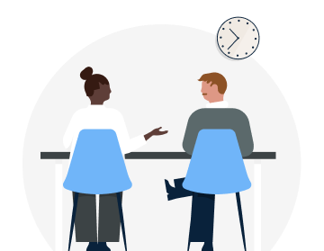 Two professionals sitting down and having a discussion