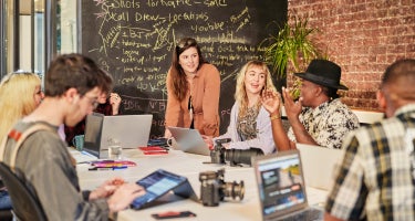 Image of professionals working on a chalkboard