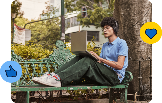Young man working on laptop in park