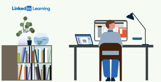man at desk with laptop and monitor