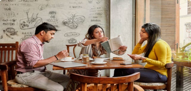 A group of professionals in a discussion around a table
