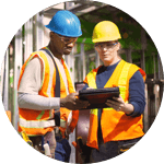 Two men in hard hats and high visibility vests