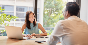 Image of smiling professionals chatting