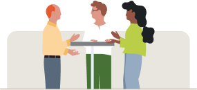 three people in conversation around a high top table