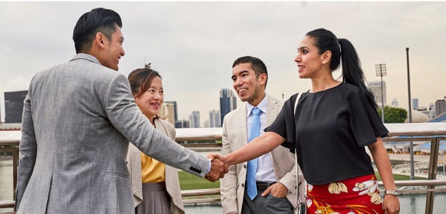 Image of professionals shaking hands