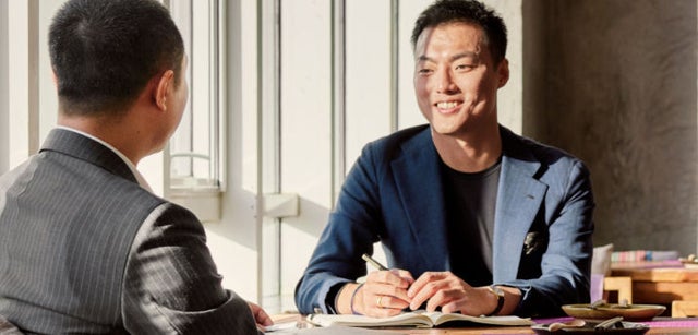 Image of two professionals collaborating
