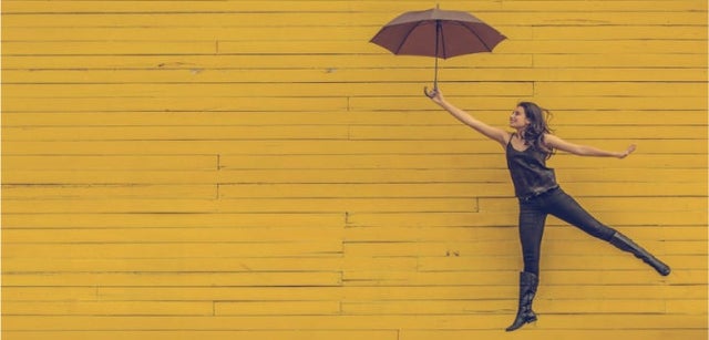 Image of professional holding up an umbrella