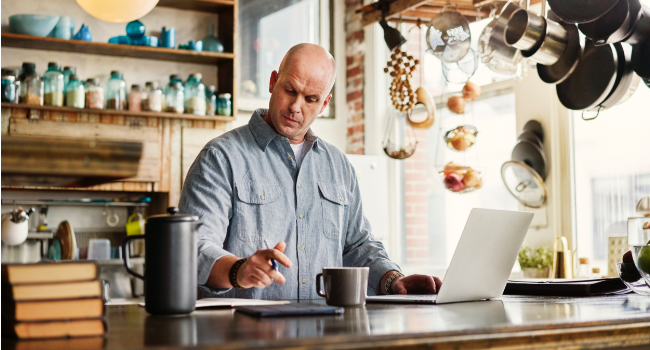 Image of man working at laptop