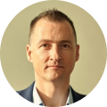Professional headshot of Simon Brown