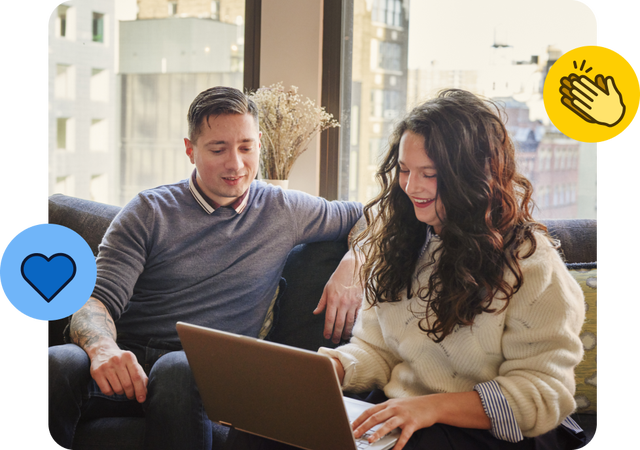 Coworkers collaborating on laptop in cozy apartment