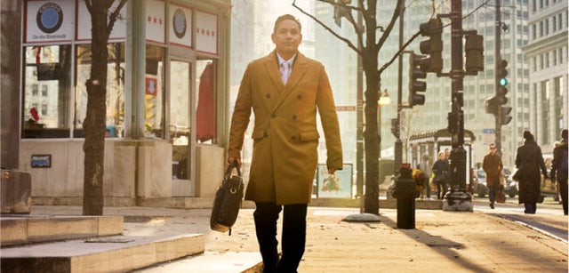 Image of professional walking through a park
