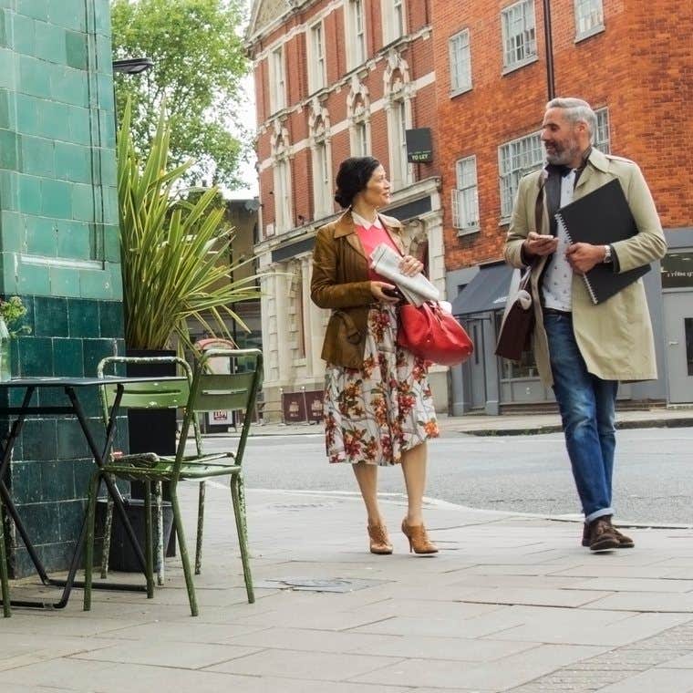 People outside a city cafe