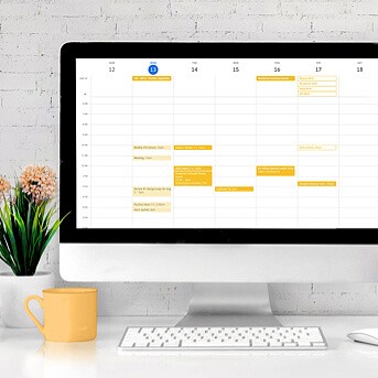 Computer screen showing calendar with several meetings booked