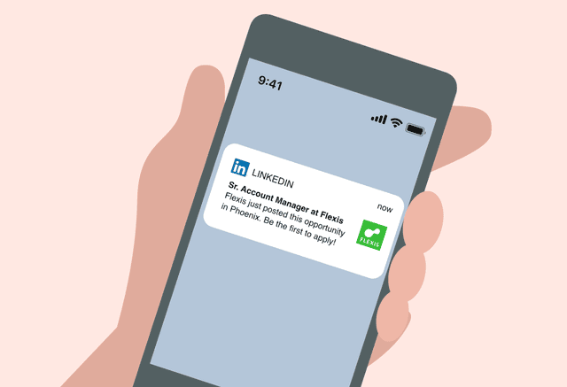 An illustrated product screenshot of a hand holding a mobile phone with a job notification on it. The notification shows a company’s name, logo, job title, and short message.