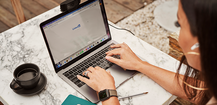 A nonprofit employee visits LinkedIn’s website on her laptop.