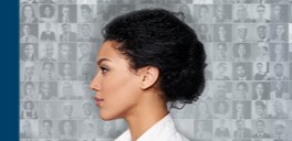 Side profile of a woman looking to the left with a black and white background compiled of the faces of many people