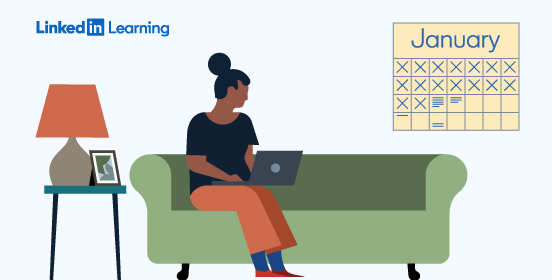 woman sitting on couch with laptop