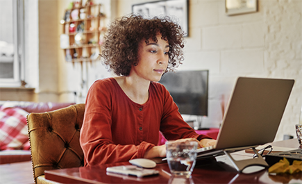 Picture of a woman typing on a computer