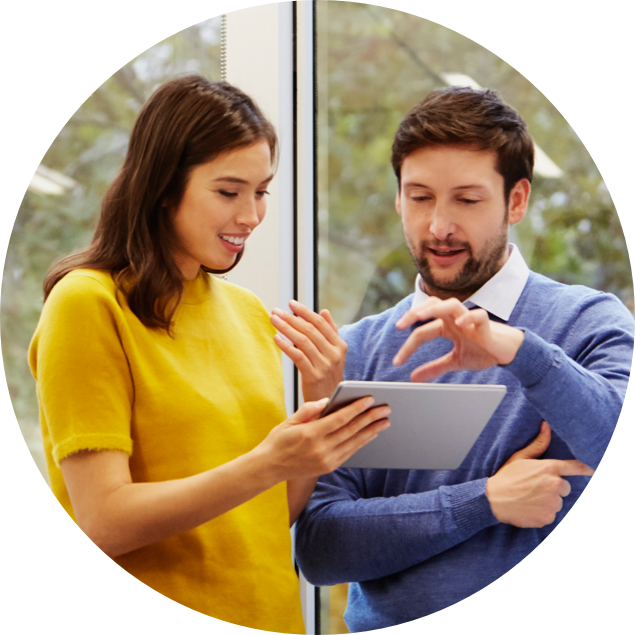 Woman and man engaging with a tablet
