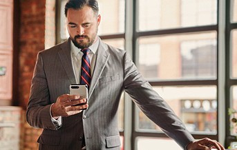 photograph of a man on his phone