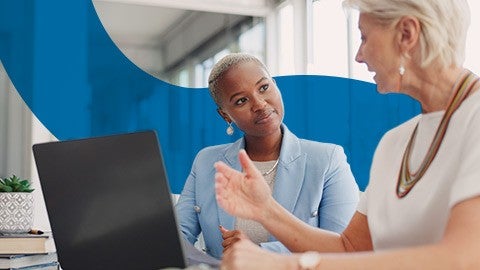 Image of two people speaking