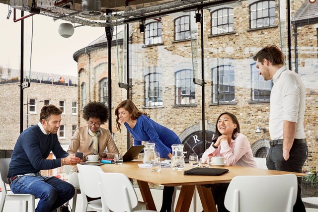 Workers in a corporate London office setting