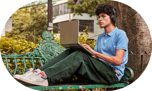 Person using a laptop outside