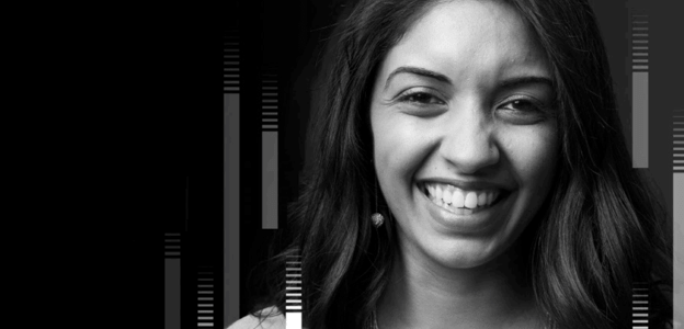 A close-up of a younger woman smiling at the camera.