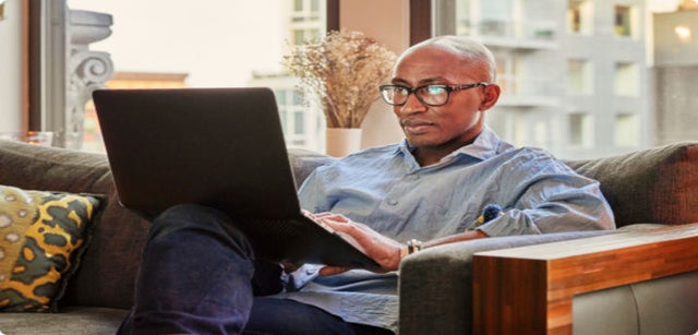 photo of a person working on a laptop