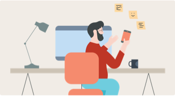 Man at computer on his phone
