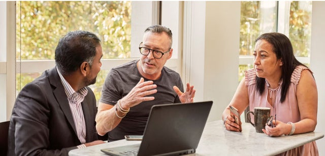 Image of professionals having a conversation