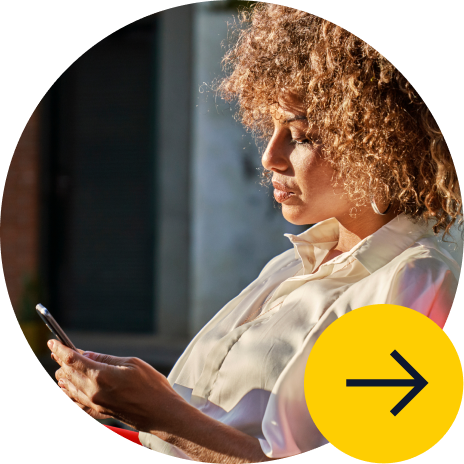 A woman looking at a mobile phone