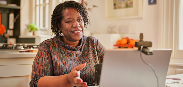 Photo of a person browsing on a laptop