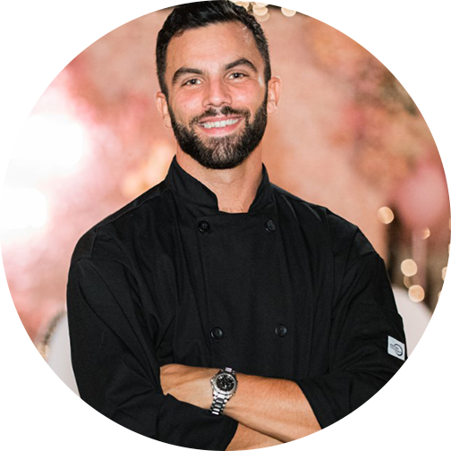 A professional headshot photo of Daniel C.