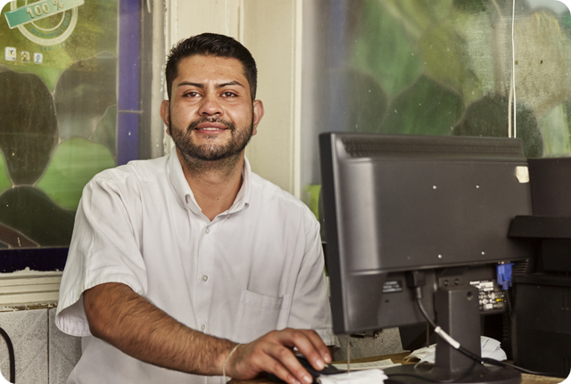 Office worker using desktop computer indoors