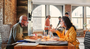 Image of two professionals chatting